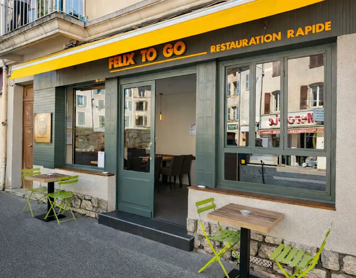 Devanture du restaurant Félix To Go avec son auvent jaune caractéristique